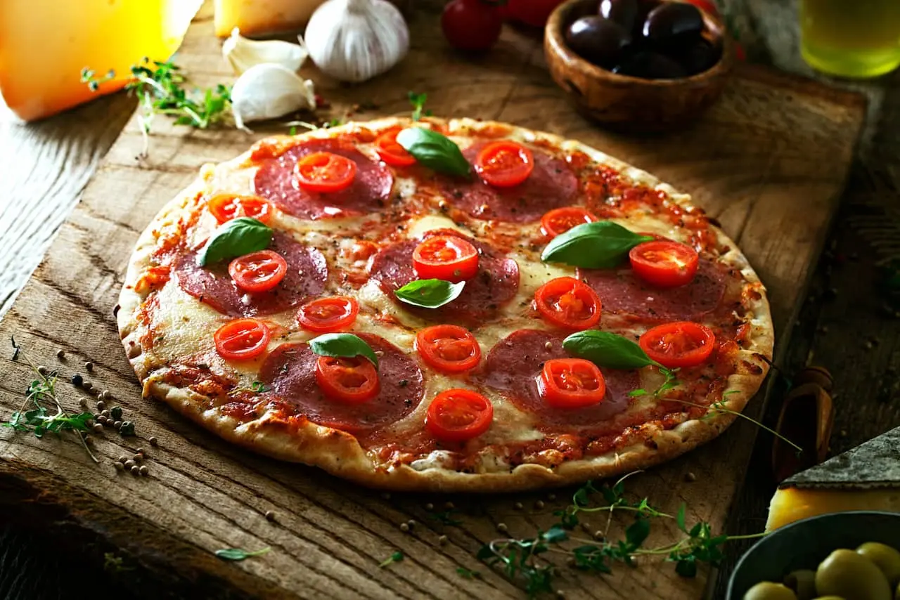 Banner promocional de pizzería que enlaza a productos de máquinas de hostelería especializadas para restaurantes de pizza.